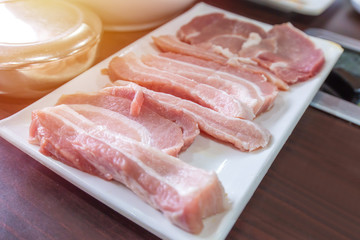 raw pork belly meat slice on dish for barbecue