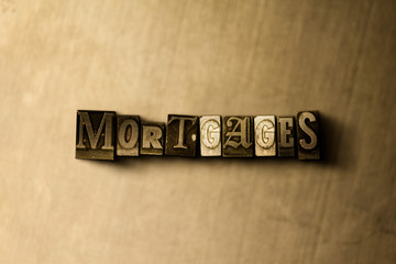 MORTGAGES - close-up of grungy vintage typeset word on metal backdrop. Royalty free stock illustration.  Can be used for online banner ads and direct mail.