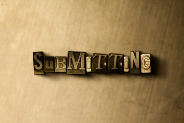 Obraz premium SUBMITTING - close-up of grungy vintage typeset word on metal backdrop. Royalty free stock illustration. Can be used for online banner ads and direct mail.