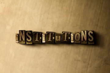 Naklejka premium INSTITUTIONS - close-up of grungy vintage typeset word on metal backdrop. Royalty free stock illustration. Can be used for online banner ads and direct mail.