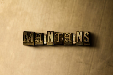 MAINTAINS - close-up of grungy vintage typeset word on metal backdrop. Royalty free stock illustration.  Can be used for online banner ads and direct mail.