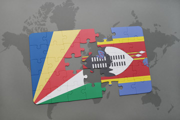 puzzle with the national flag of seychelles and swaziland on a world map
