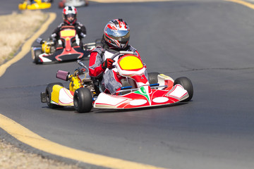Adult Go Kart Racers on Track - obrazy, fototapety, plakaty