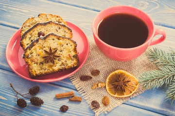 Vintage photo, Cup of coffee, fresh baked fruitcake for Christmas and spruce branches