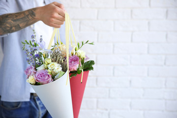 Man holding beautiful bouquets