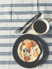 Fried eggs breakfast with coffee cup