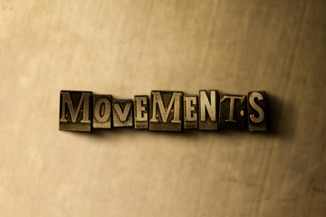 Naklejka premium MOVEMENTS - close-up of grungy vintage typeset word on metal backdrop. Royalty free stock illustration. Can be used for online banner ads and direct mail.