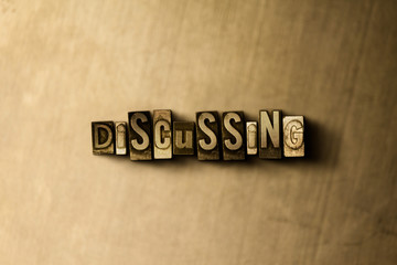 Fototapeta premium DISCUSSING - close-up of grungy vintage typeset word on metal backdrop. Royalty free stock illustration. Can be used for online banner ads and direct mail.