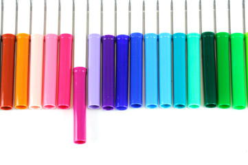 colorful markers in a row isolated on white background