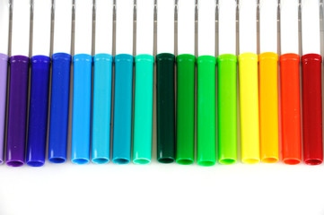 colorful markers in a row isolated on white background