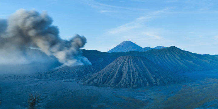 Mount Bromo volcano erupting before sunrise, East Java, Indonesia