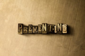 Fototapeta na wymiar PREVENTING - close-up of grungy vintage typeset word on metal backdrop. Royalty free stock illustration. Can be used for online banner ads and direct mail.