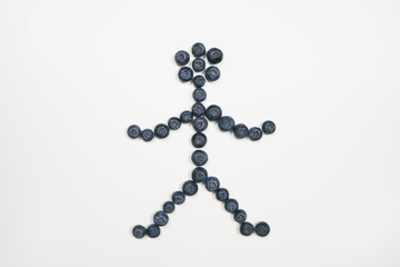 Blueberries in human shape with white background