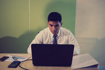 Businessman thinking about business plan at his office
