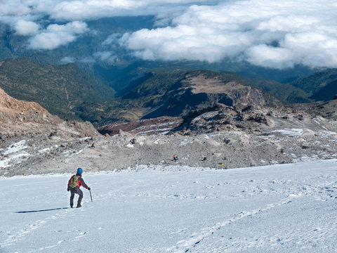 Hiker descending Mexico's highest mountain, Pico de Orizaba, that stands at  5,636 m (18,491 ft)