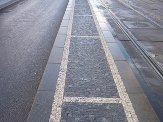empty city street with tram lines