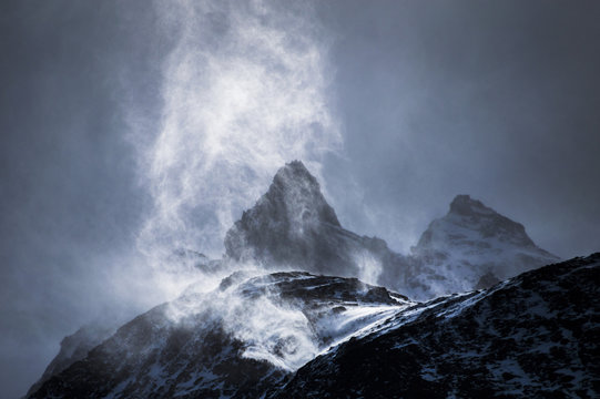Wind sweeping snow off mountains, Torres del Paine National Park, Patagonia, Chile