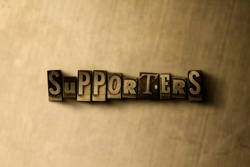 SUPPORTERS - close-up of grungy vintage typeset word on metal backdrop. Royalty free stock illustration.  Can be used for online banner ads and direct mail.