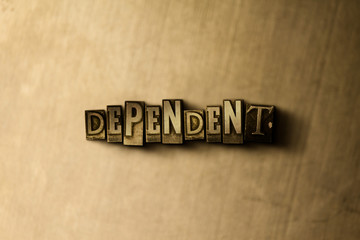 DEPENDENT - close-up of grungy vintage typeset word on metal backdrop. Royalty free stock illustration.  Can be used for online banner ads and direct mail.