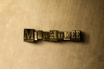 MILWAUKEE - close-up of grungy vintage typeset word on metal backdrop. Royalty free stock illustration.  Can be used for online banner ads and direct mail.