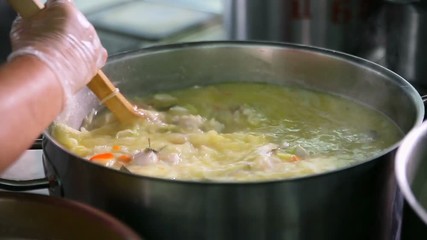 The process of cooking in the dining room.