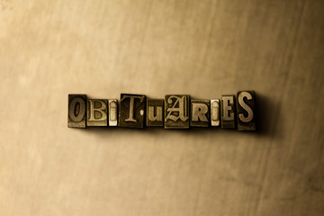 OBITUARIES - close-up of grungy vintage typeset word on metal backdrop. Royalty free stock illustration.  Can be used for online banner ads and direct mail.