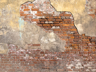 Old damaged brick wall and plaster
