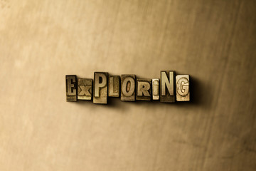 EXPLORING - close-up of grungy vintage typeset word on metal backdrop. Royalty free stock illustration.  Can be used for online banner ads and direct mail.