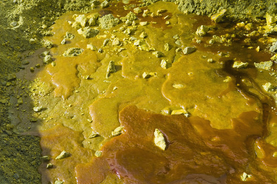 Liquid sulphur solidifying on the ground at Kawah Ijen, Java, Indonesia