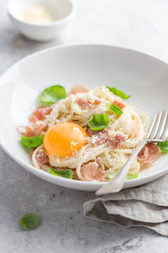 pasta carbonara with prosciutto,  parmesan cheese and eggs yolk