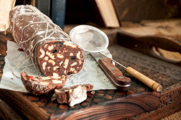 Chocolate salami served on a wooden board 