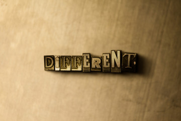 DIFFERENT - close-up of grungy vintage typeset word on metal backdrop. Royalty free stock illustration.  Can be used for online banner ads and direct mail.