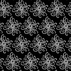 Seamless pattern with grey flowers on black background.