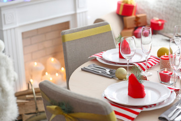 Table served for Christmas dinner in living room, close up view