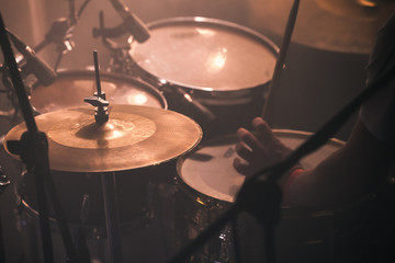 Drummer plays on rock drum set