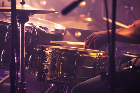 Drummer plays on drum set, vintage