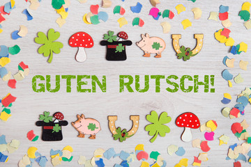 Hintergrund mit Glückssymbolen-Guten Rutsch!