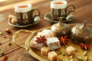 Fresh tea composition on wooden background