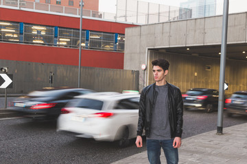 Beautiful young man posing in an urban context
