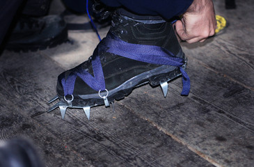 Crampons closeup. Crampons closeup. Crampon on winter boot for c