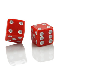 Red dice on white with reflection