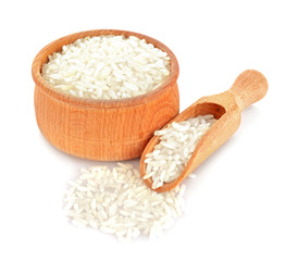 Long grain rice in wooden bowl and scoop on white background
