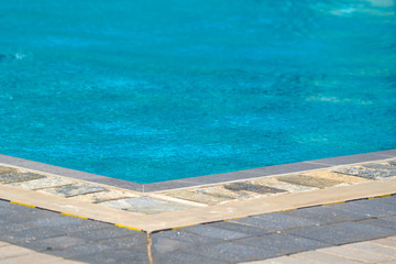 Hotel swimming pool with sunny reflections