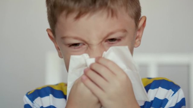 Sick Child wiping his nose