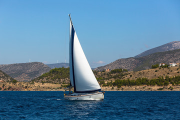 Fototapeta na wymiar Sailing in the wind through the waves at the Sea.
