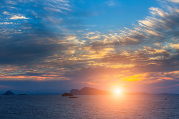 Stunning sunset among Islands in the Aegean sea.