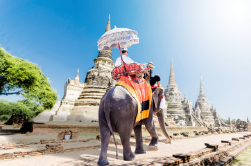 Tourists riding elephants in Ayutthaya,Thailand