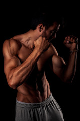 Fototapeta na wymiar Strong sexy man with gym muscular body