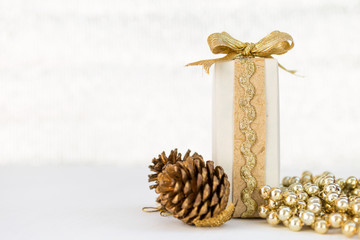 White gift box with gold ribbon on white background, Christmas concept gift