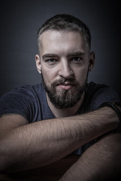 Portrait of a young man with a beard. Toned